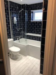 Black tiles installed in a bathroom in Portsmouth