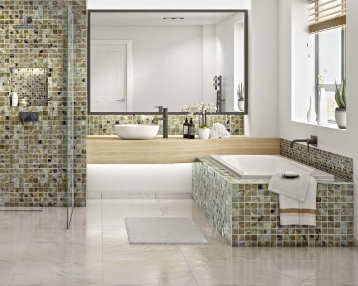 Modern bathroom interior with natural stone tiling detailing and a freestanding basin.